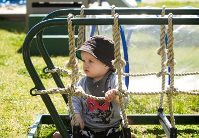 Child looking out from playground