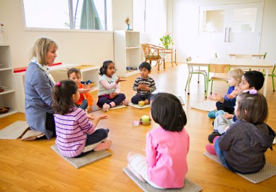 Group gathering in classroom with kids